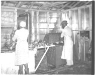 Interior of new dressing plant at Royston showing chickens being scalded and picked with picking machine