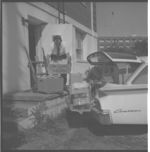 Harvey Lowery loading seed samples going to State Seed Lab