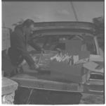 Harvey Lowery loading seed samples going to State Seed Lab