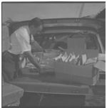 Harvey Lowery loading seed samples going to State Seed Lab