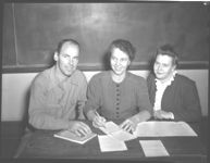 S.C. Gunnels, C.A., Clarkesville; Mrs. Homer Cook, State 4-H Club advisor, and Gwendolyn Hines, H.D.A., planning 4-H program