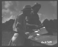 Conservationist Smith at left with operator discussing plan of operations on Farm No. 88