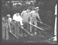 J.E. Phillips, Extension forester, shows 4-H Club members how to fight a forest fire at the 1943 wildlife camp at Camp Washega