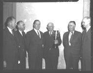 Some of the officials who attended the exercises at Fayetteville when farmers in that county received a trophy for outstanding one variety cotton work in 1944. The award was made at Fayetteville in the spring of 1945, and shown in the picture left to right are: E.C. Westbrook, cotton specialist of the Extension Service; Walter S. Brown, director of the Extension Service; C.D. Redwine, Fayette County farmer; Paul Williams, Athens cotton merchant; and C.A. McLendon, agronomist of the U.S. Bureau of Plant Industry