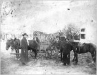 Still (whiskey) on wagon with 4 revenue agents
