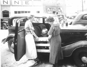 Eastman NYA Group. Loading crate into car
