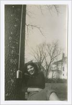 Photograph of a young woman and an electrical outlet in a tree, Gainesville, Georgia, 1952-1955