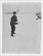 Photograph of a young man with a snowball, Georgia, 1952-1955