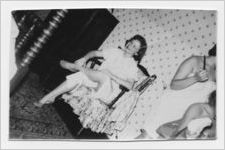 Photograph of a young woman sitting in a chair, Gainesville, Georgia, 1952 May