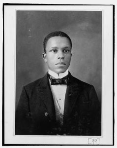 [Young African American man, head-and-shoulders portrait, facing slightly right]