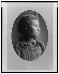[African American girl, head-and-shoulders portrait, facing right]