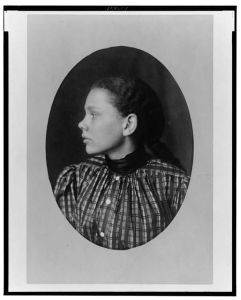 [African American girl, head-and-shoulders portrait, left profile]