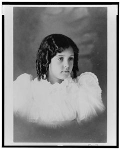 [African American girl, head-and-shoulders portrait, facing right]