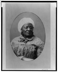 [African American woman, head-and-shoulders portrait, facing slightly right]