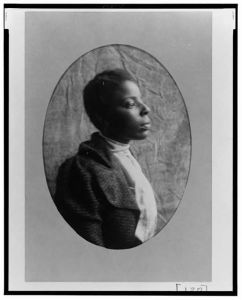 [African American woman, head-and-shoulders portrait, right profile]