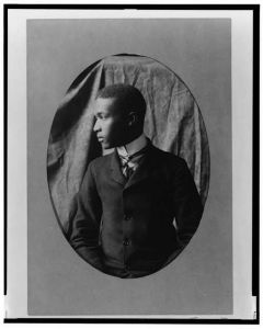 [African American man, half-length portrait, left profile]