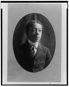 [Young African American man, head-and-shoulders portrait, facing slightly right]