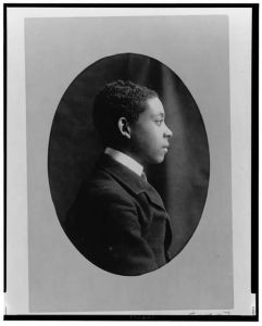 [Young African American man, head-and-shoulders portrait, right profile]