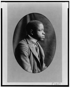 [African American man, half-length portrait, right profile]