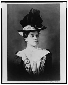 [African American woman, head-and-shoulders portrait, wearing hat, facing slightly right]