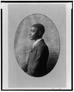 [African American man, half-length portrait, left profile]