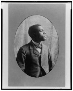 [African American man, half-length portrait, right profile]