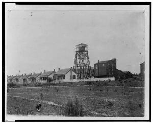 [Row of houses with water tower]