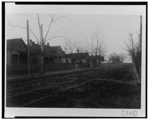[View of unpaved street with houses in Georgia]