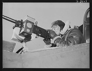 Fort Benning. Aerial machine gunners. Four aces. This crack aerial machine gunner is part of an unbeatable combination. He has a fast, accurate gun and the world's best in the way of plane and pilot