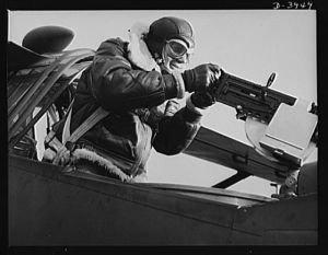 Fort Benning. Aerial machine gunners. Four aces. This crack aerial machine gunner is part of a an unbeatable combination. He has a fast, accurate gun and the world's best in the way of plane and pilot