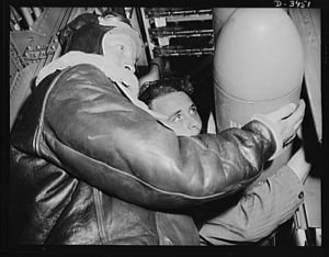Fort Benning. Loading planes. Axis, beware! Bombardiers in training at Fort Benning, Georgia use practice bombs to learn the routine of loading a light bombing plane