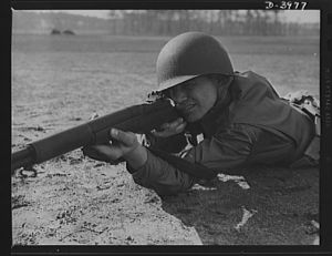 Fort Benning. Rifleman. Garand rifle. When Uncle Sam makes big medicine against his enemies, he puts in strong ingredients. An American infantryman with a Garand rifle to meet the Army's high standards of workmanship