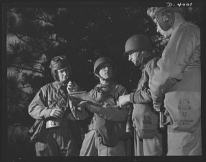 Fort Benning. Armored forces personnel. Council of the powers. A group of armored-forces officers work out a tactical problem and map a course of action that will broaden the training program at Fort Benning, Georgia