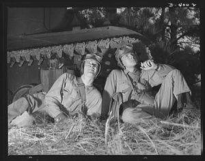 Fort Benning. Armored forces personnel. Soldiers of the armored forces get few chances for a smoke and a short nap. After they've completed their training at Fort Benning, Georgia, they'll know a lot of new ways to put the heat on the Axis
