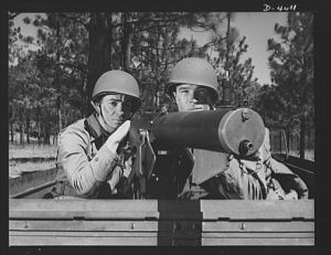 Fort Benning. Machine gunners, armored forces.  Our armored forces have tremendous fire power. These machine gunners on a halftrac scout car make the .30 caliber Browning one of the most destructive of modern weapons