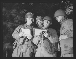 Fort Benning. Armored forces personnel. Council of the powers. A group of armored forces officers work out a tactical problem and map a course of action that will broaden the training program at Fort Benning, Georgia
