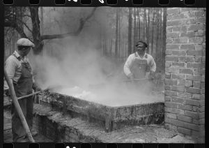 [Untitled photo, possibly related to: Cleaning turpentine cups in boiling water at a still near Pembroke, Georgia]