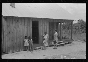 [Untitled photo, possibly related to: FSA (Farm Security Administration) home management supervisor pointing out to rehabilitation borrower where new privy will be located. Greene County, Georgia]