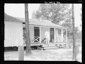 Dr. Herman Dismude, Ocilla, Georgia, leaving Grady Watson home after treating a child. Dr. Dismude, by special arrangement, takes care of all residents of Irwinville Farms resettlement project at reduced rates