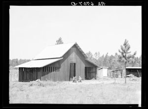 "Bryan" barn on rural resettlement farm unit in Irwinville Farms, Georgia.  This barn, designed and built under supervision of W.P. Bryan, project manager, cost one hundred forty-five dollars. This compared with the cost of three hundred fifty dollars of Rural Resettlement Administration-specified barn