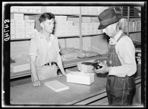 Buying shoes in the cooperative store at Irwinville Farms, Georgia