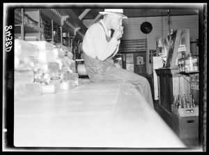 [Untitled photo, possibly related to: Clerk in the cooperative store in Irwinville Farms, Georgia]