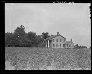 Pharr Plantation house near Social Circle, Georgia. This house was built in 1840 by slave labor. The bricks came from England to Savannah, thence by oxteam to the plantation. The plantation formerly had 150 slaves, is now abandoned by the one remaining member of the family, and the land rented out to small farmers