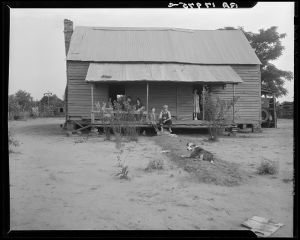 Landless family of cotton sharecroppers, Macon County, Georgia. For their labor they receive half the crop they produce, and the equivalent of ten dollars a month "furnish" (credit) from the landlord. Their vegetable garden failed this year for lack of rain
