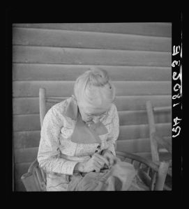 Southern lady of the old school on veranda of the "Big House" at the Wray Plantation, Georgia