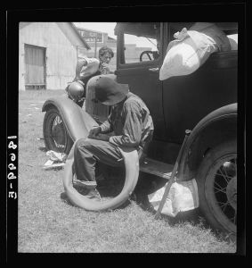 Douglas, Georgia. South Georgia tobacco sharecroppers. Fords are beginning to appear among the tobacco sharecroppers. They can bring the crop to the auction at the warehouse, take flour and groceries back to the farm and even carry the boys to Florida for a season's work in the fruit