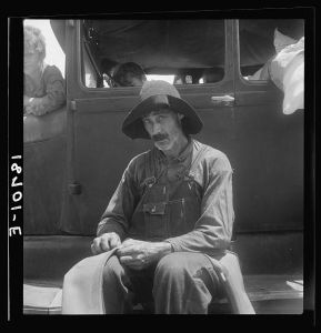Douglas, Georgia. South Georgia tobacco sharecropper during the tobacco auction. In order to eke out a living members of the sharecropper families in recent years have begun to migrate to Florida after cotton or tobacco harvest to work in fruits or vegetables