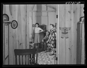 The Edwards family in their prefabricated home at the Hazlehurst Farms Inc., Hazlehurst, Georgia. They owned a farm in Willie, Georgia in the Hinesville Army camp area