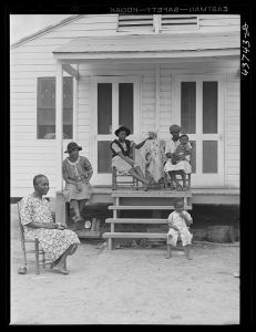 [Untitled photo, related to: Negro family and friends at one of the prefabricated houses for Negroes at Hazlehurst Farms Inc., Hazlehurst, Georgia]