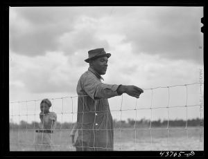 [Untitled photo, possibly related to: Two of the Negro people who have been moved out of the Camp Stewart area near Hinesville to Hazlehurst Farms. Hazlehurst, Georgia]